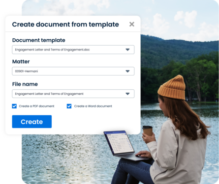 A person creates a document in Clio on a laptop while working remotely by a lake.